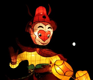 The Monkey looks as though he's about to catch the moon and eat it!
